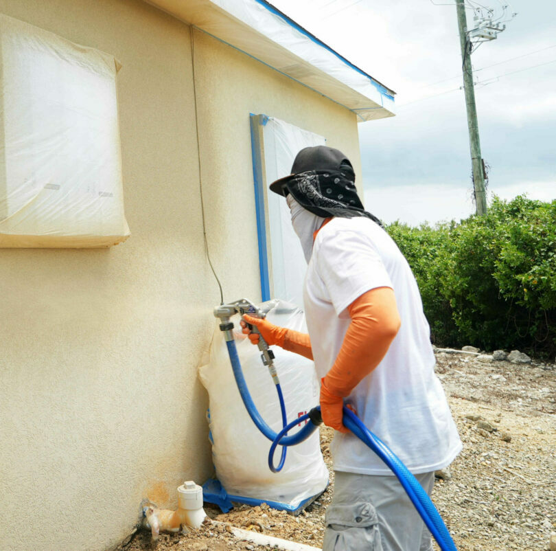 spray-cork-being-applied-to-cayman-islands-home